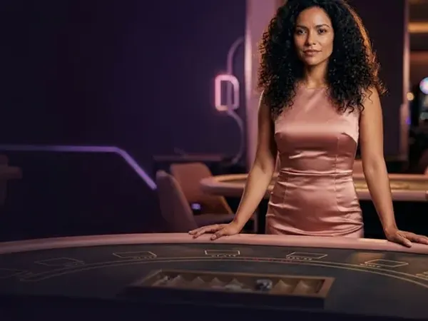 Lobby-style demo game card: portrait crop of the croupier at a rose-gold table